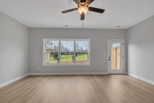 empty room with ceiling fan and light wood-type flooring