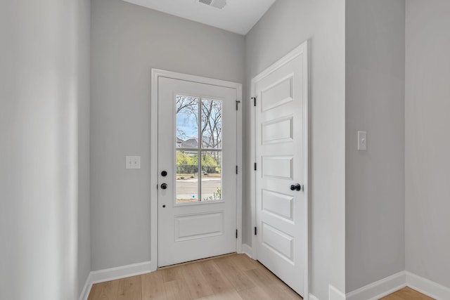 entryway with light hardwood / wood-style flooring