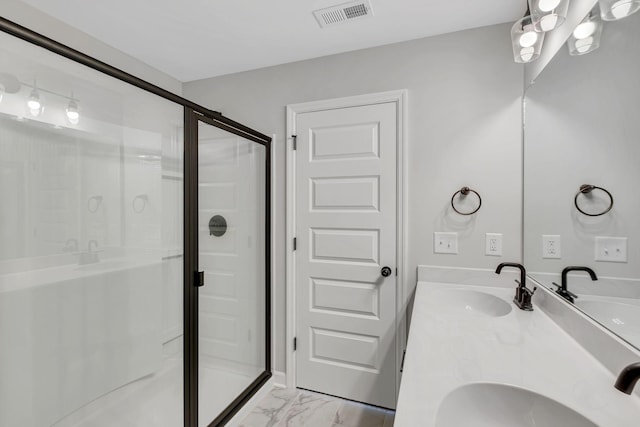 bathroom with vanity and an enclosed shower