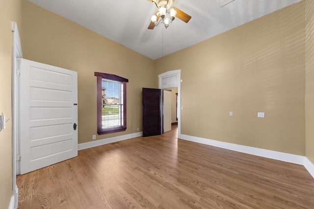 unfurnished room featuring light hardwood / wood-style flooring and ceiling fan