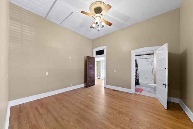 unfurnished bedroom with ceiling fan and light wood-type flooring