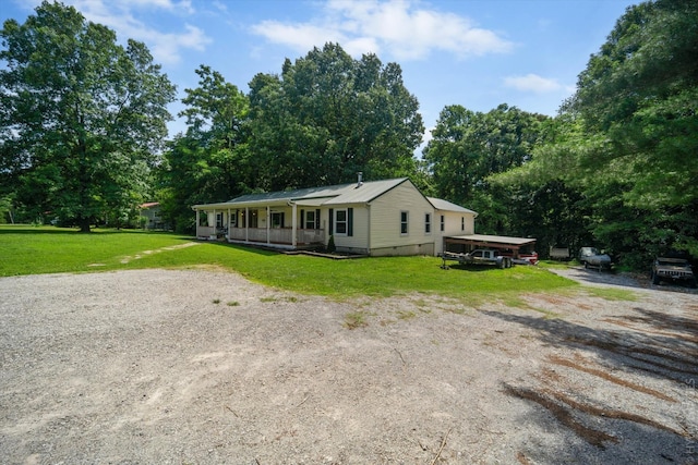 view of front of home featuring a front yard and a porch