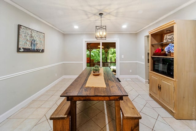 dining space featuring an inviting chandelier, light tile patterned floors, and crown molding