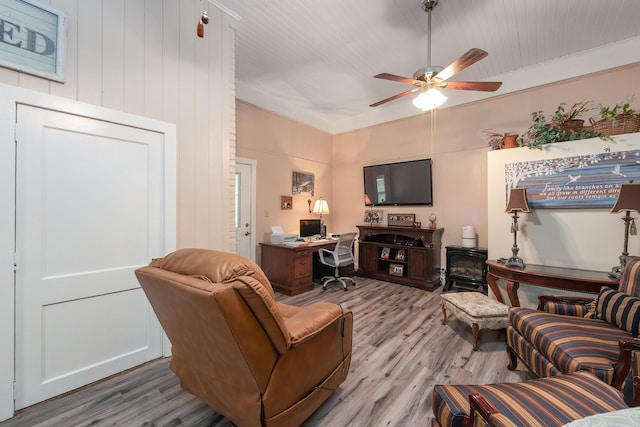 living room with ceiling fan and hardwood / wood-style floors