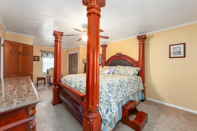 carpeted bedroom with ceiling fan and crown molding