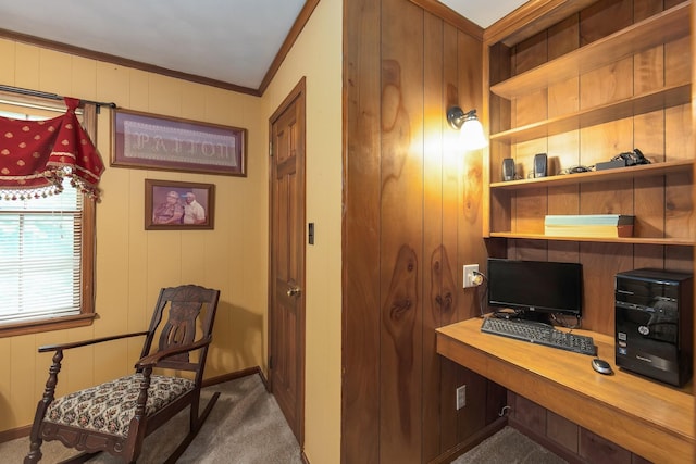 carpeted office featuring wooden walls and ornamental molding