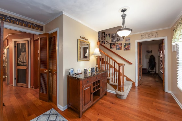 corridor featuring crown molding and wood-type flooring