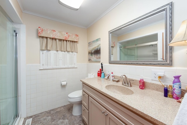 bathroom featuring tile walls, toilet, vanity, and ornamental molding