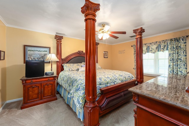 carpeted bedroom with ceiling fan and crown molding