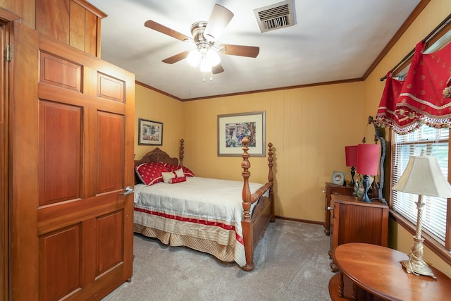 bedroom with ceiling fan, crown molding, and light colored carpet