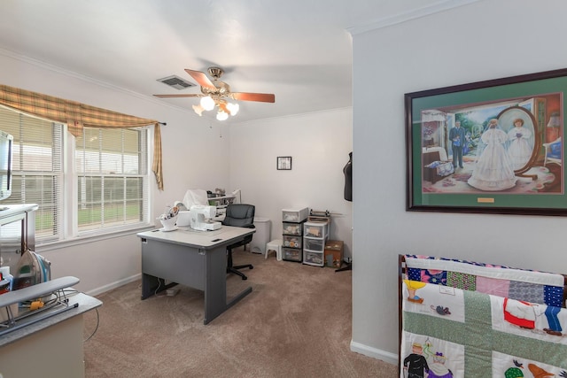 office area featuring ceiling fan, carpet flooring, and ornamental molding