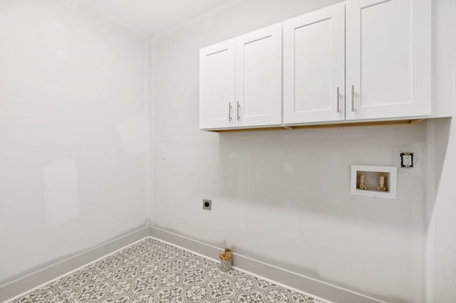 clothes washing area featuring cabinets, hookup for an electric dryer, and washer hookup