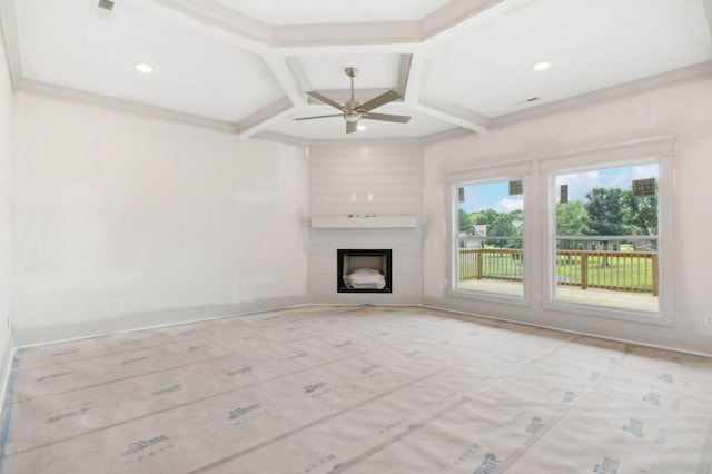 unfurnished living room with a large fireplace, ceiling fan, and coffered ceiling