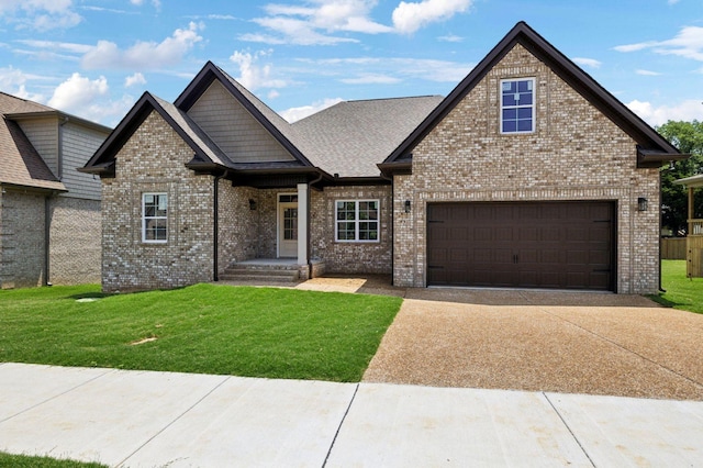 view of front of home featuring a garage and a front lawn