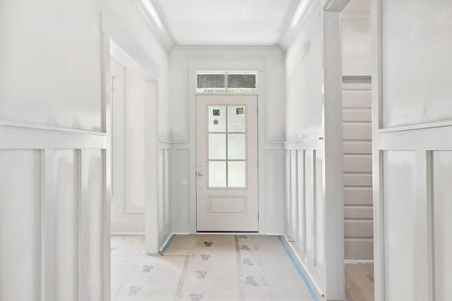 doorway featuring ornamental molding