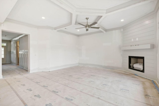 unfurnished living room featuring ceiling fan, coffered ceiling, and crown molding