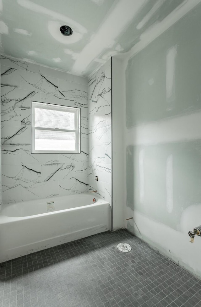 bathroom with a tub to relax in