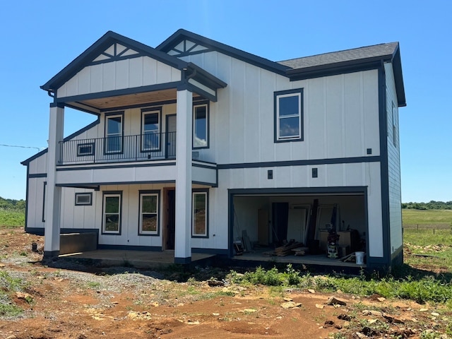 rear view of house with a balcony