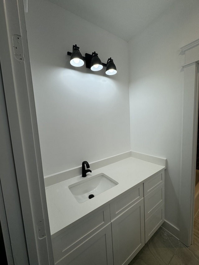 bathroom featuring vanity and tile patterned flooring