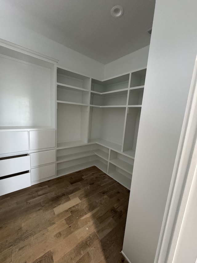 spacious closet featuring hardwood / wood-style floors