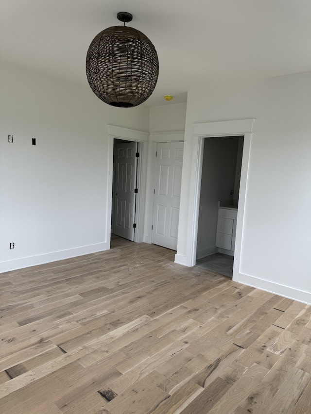 interior space featuring light hardwood / wood-style flooring and connected bathroom