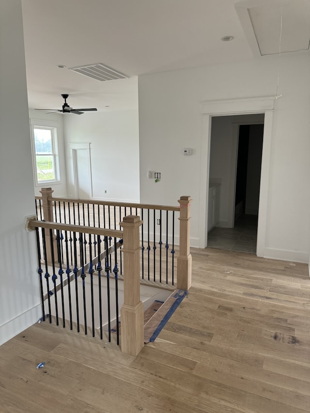 hallway with wood-type flooring