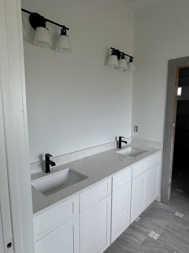 bathroom with double vanity and tile patterned floors