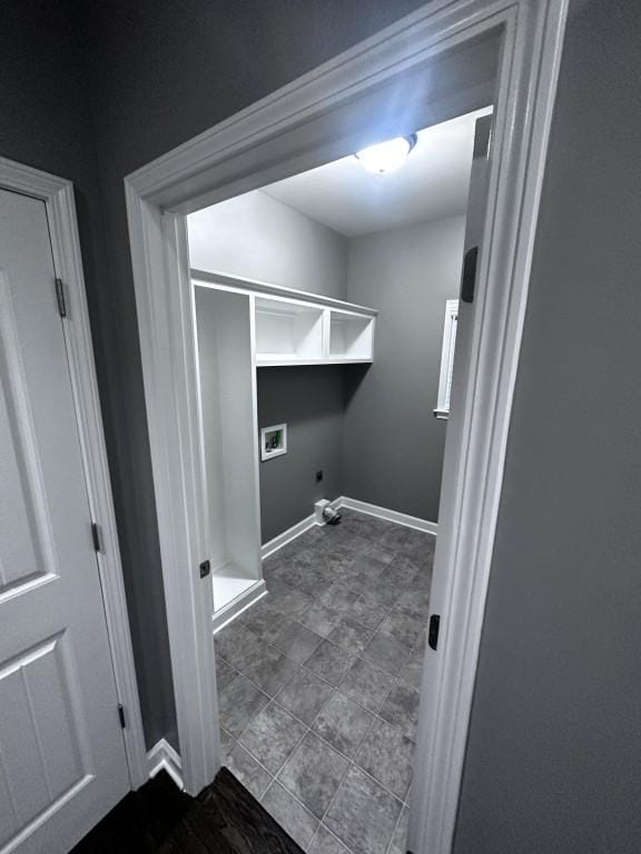 laundry room with gas dryer hookup, laundry area, washer hookup, baseboards, and electric dryer hookup