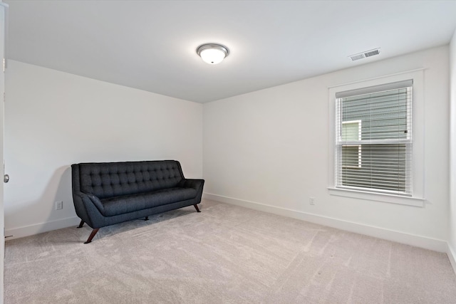 living area with light colored carpet