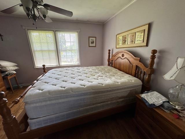 bedroom with ceiling fan, hardwood / wood-style flooring, and ornamental molding