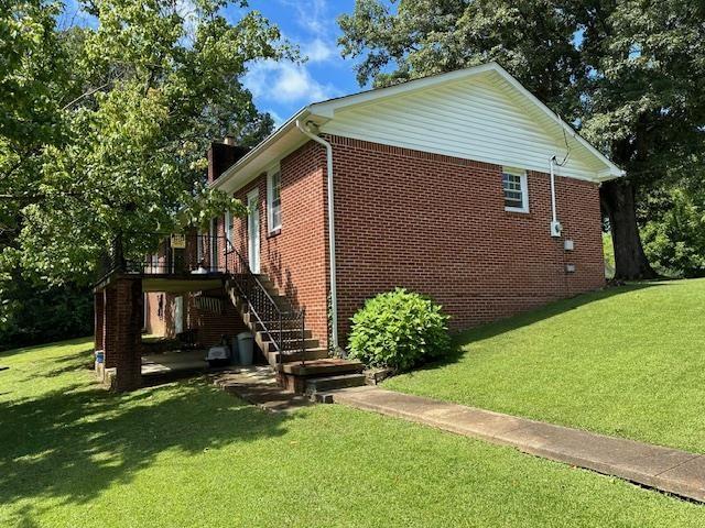 view of home's exterior featuring a yard