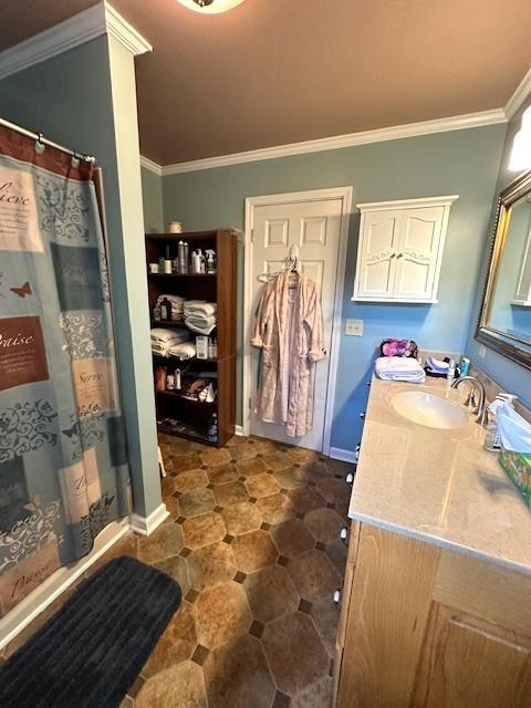 bathroom with ornamental molding, a shower with shower curtain, and vanity