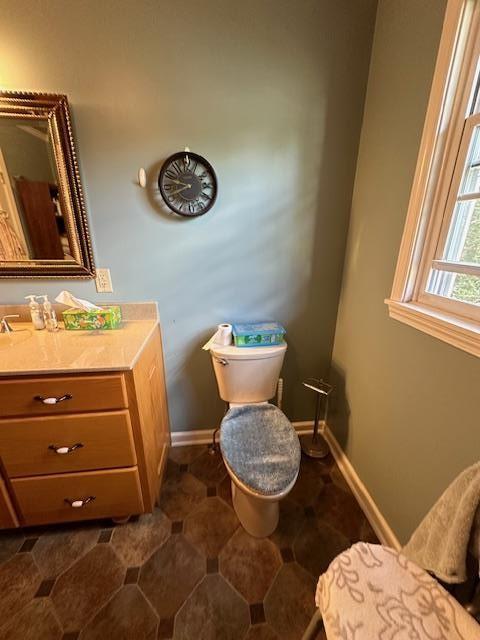 bathroom with toilet and vanity