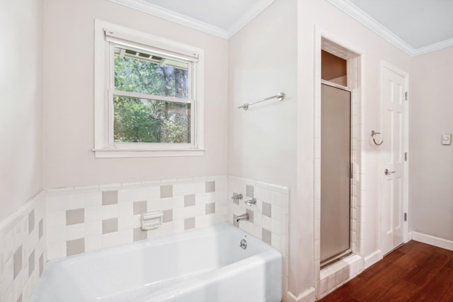 bathroom featuring wood-type flooring, plus walk in shower, and crown molding