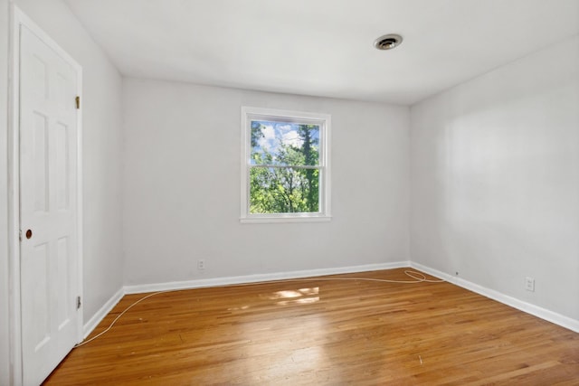 unfurnished room with light hardwood / wood-style flooring