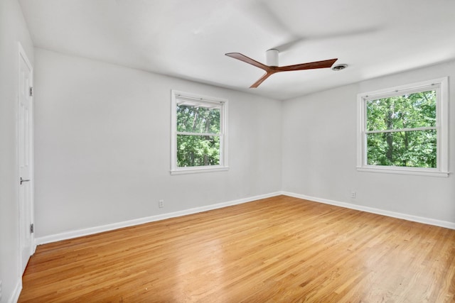 empty room with light hardwood / wood-style flooring and ceiling fan