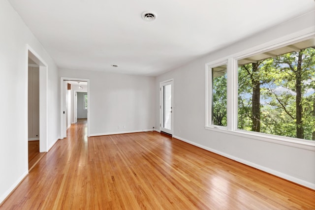 spare room with light wood-type flooring