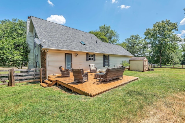 back of property with an outdoor living space, a yard, a storage shed, and a deck