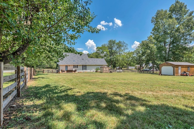 view of yard featuring a shed and a rural view