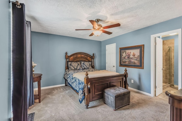 carpeted bedroom with ceiling fan, connected bathroom, and a textured ceiling