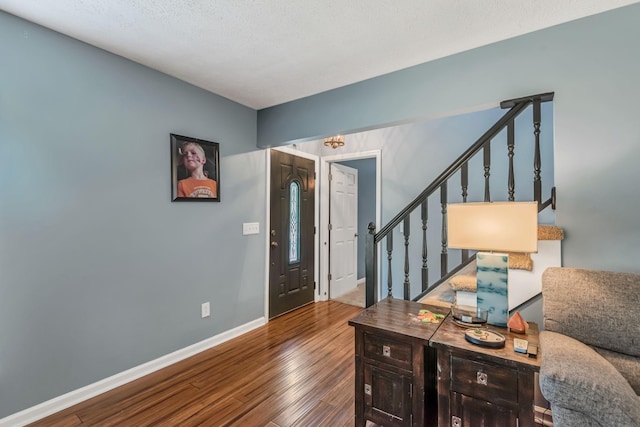 foyer entrance featuring hardwood / wood-style flooring