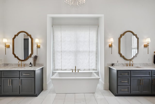 bathroom with vanity, a tub to relax in, and tile patterned floors