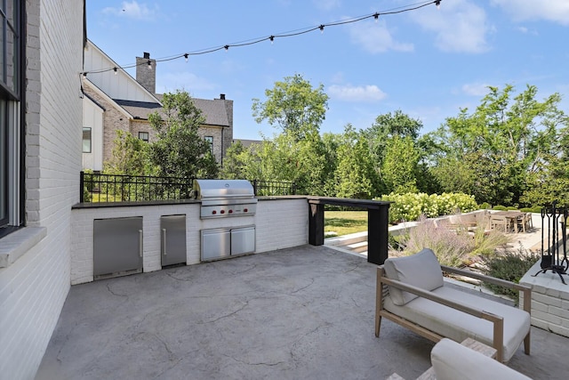 view of patio / terrace with area for grilling and exterior kitchen