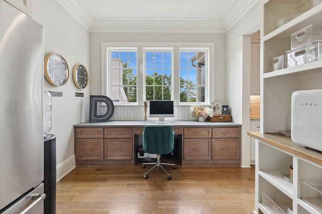 office area with light hardwood / wood-style floors