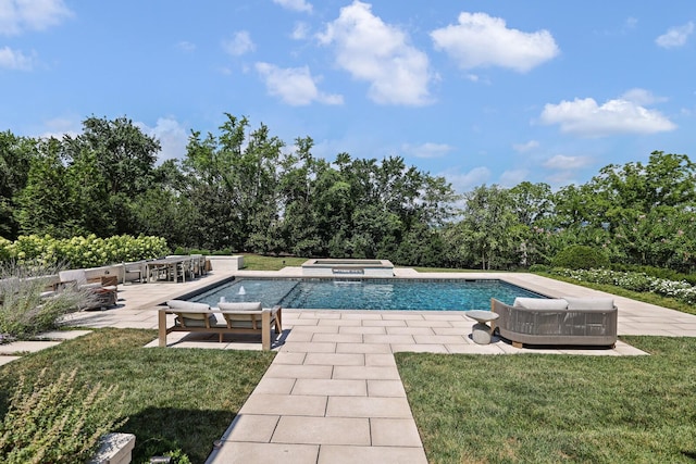 view of swimming pool with an in ground hot tub, a patio area, and a lawn