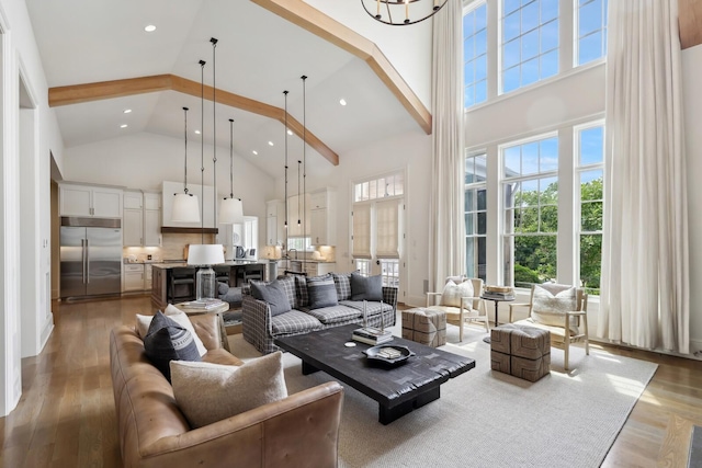 living room with hardwood / wood-style flooring and high vaulted ceiling