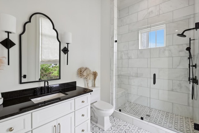 bathroom with vanity, toilet, tile patterned flooring, and a shower with door