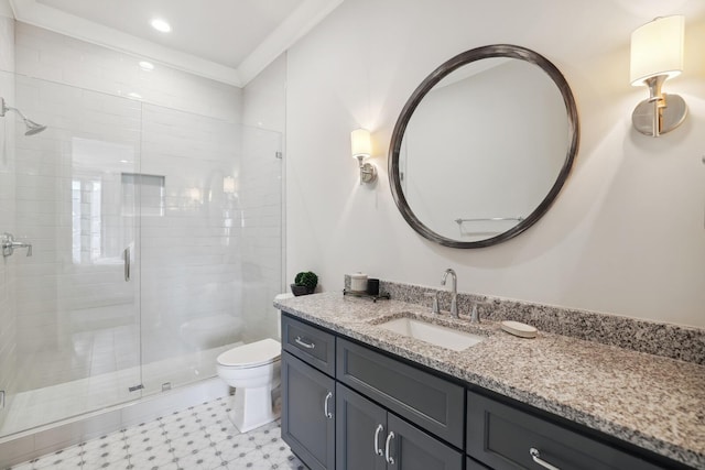 bathroom featuring a shower with door, vanity, crown molding, and toilet