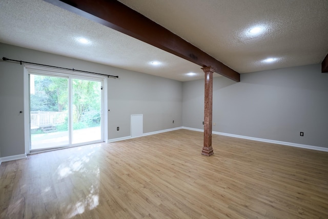 basement with a textured ceiling and light wood-type flooring