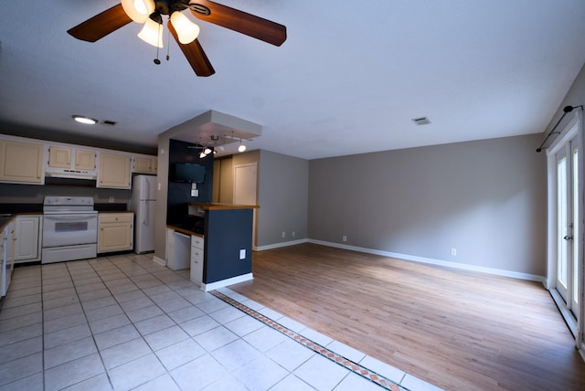 kitchen with ceiling fan, light tile patterned floors, white cabinets, and white appliances